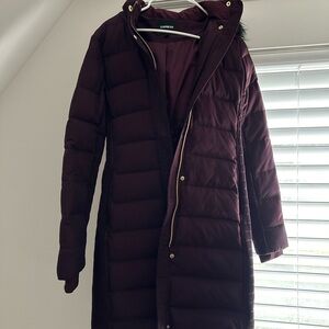 Burgundy winter coat barely worn. Includes hood and belt.